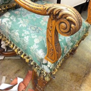 old green armchair armrest