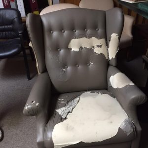 ripped armchair